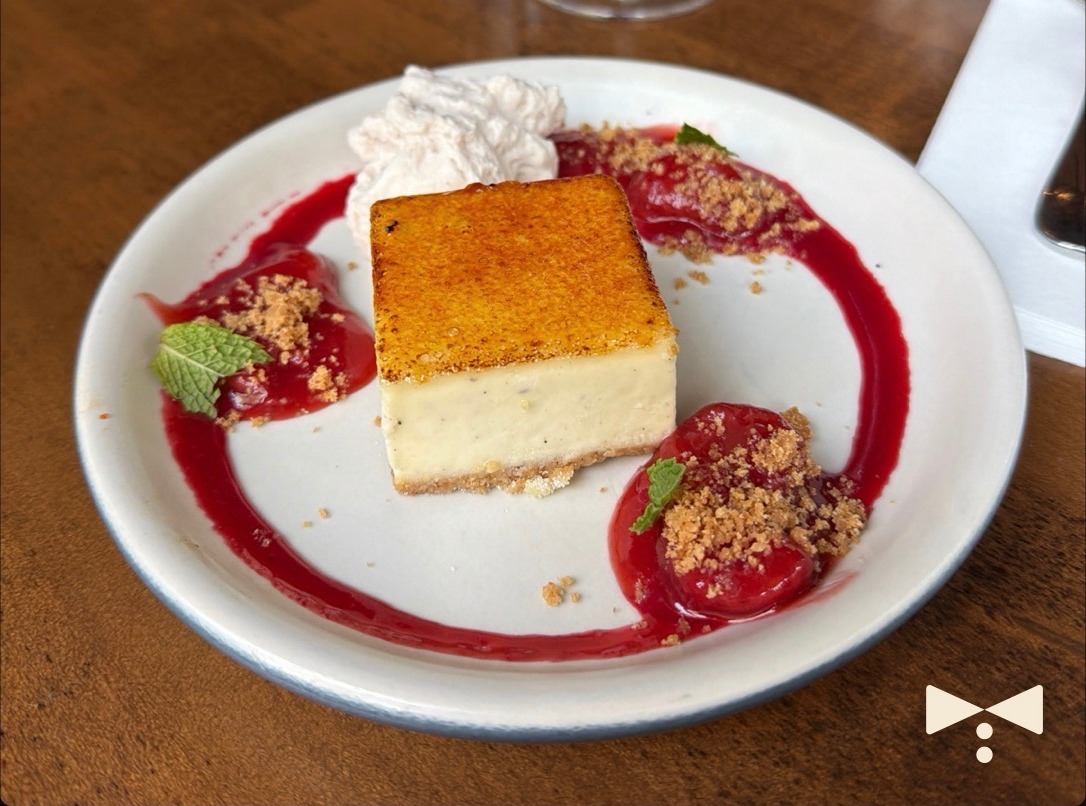 Butler share card showing a crème brûlée cheesecake with berry coulis, marked with the Butler bow tie